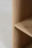A close-up view of a wooden shelf, showing the grain and texture of the wood. Podgląd zdjęcia produktu