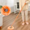 A person is using a mop to clean a wooden floor in a room with a desk and chair in the background. Náhled obrázku produktu