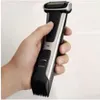 A hand holding a body groomer. Podgląd zdjęcia produktu