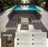 An outdoor lounge set with a pool in the background. Náhled obrázku produktu