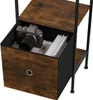 A close-up view of a drawer in a shelf unit, containing a camera and keys. Produktbild-Vorschau
