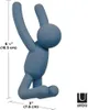 A blue UMBRA Buddy Hook shaped like a climbing person, with dimensions indicated. Náhled obrázku produktu