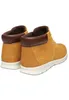 A pair of tan Timberland chukka boots shown from the back-left. Produktbild-Vorschau