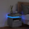 A modern bedside table with LED lighting in a bedroom setting. Produktbild-Vorschau