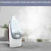 A close-up shot of a steam iron emitting steam, placed on a gray surface. Voir les images du produit