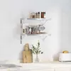 A kitchen counter with shelves mounted on a tiled wall. Anteprima dell’immagine prodotto