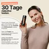 A woman is holding a product bottle and smiling. Anteprima dell’immagine prodotto