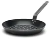 A black cast iron pan with a short handle and a perforated bottom, shown against a white background. Voir les images du produit