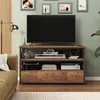 A TV stand with a TV and electronic devices in a living room setting. Podgląd zdjęcia produktu
