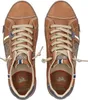A top-down view of a pair of brown lace-up shoes. Produktbild-Vorschau