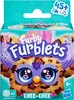 The image shows the packaging of a Furby Furblet toy. The packaging features a cartoonish illustration of the toy, its name, and other branding elements. Produktbild-Vorschau