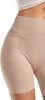 Close-up of a person's hip and upper thigh wearing beige ribbed biker shorts. Produktbild-Vorschau
