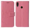 A pink flip phone case with a floral and butterfly design is shown from the front and back. Produktbild-Vorschau