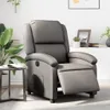 A gray recliner chair is shown in a living room setting with a side table and plants.