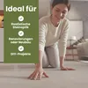 A woman is kneeling on a floor, touching it with her hand. A green overlay with text is on the left side of the image. Produktbild-Vorschau