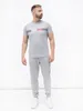 Tommy Hilfiger Męskie spodnie dresowe z logo z boku, szare Podgląd zdjęcia produktu 2