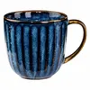 A single blue mug with a textured surface and a brown handle, isolated on a white background. Produktbild-Vorschau