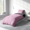 A bedroom scene with a bed made up with pink and anthracite bedding. Produktbild-Vorschau