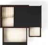 A top-down view of an open jewelry box with multiple compartments. Voir les images du produit