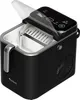 A black TurboTronic ice maker with its lid open, showing the interior ice-making mechanism. The product is placed on a white background. Náhled obrázku produktu