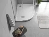 A modern bathroom scene featuring a white shower tray, a towel hanging on the wall, and a small table with toiletries. Anteprima dell’immagine prodotto