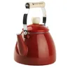 A red enamel kettle with a wooden handle is shown against a white background. Podgląd zdjęcia produktu
