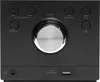 A close-up front view of a black compact stereo system with a large silver volume dial and several control buttons. Náhled obrázku produktu