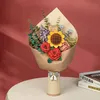 A 3D wooden puzzle bouquet is displayed on a table against a pink background. Produktbild-Vorschau