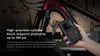 A hand holding a portable air compressor next to a bicycle. Produktbild-Vorschau