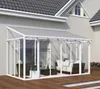 A white aluminum conservatory with a polycarbonate roof attached to a house, furnished with outdoor seating and a coffee table, situated on a wooden deck. Podgląd zdjęcia produktu