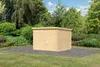 A wooden shed is shown in a garden setting with lush greenery and a paved area in front of it. Produktbild-Vorschau