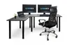 A black L-shaped desk with two monitors, a laptop, and a chair, set against a white background. Produktbild-Vorschau