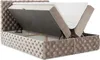 A tufted beige upholstered bed frame with the mattress lifted to reveal storage space underneath. Produktbild-Vorschau
