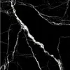 A close-up of a black marble tile with white veining. Podgląd zdjęcia produktu
