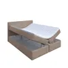 A bed with its storage compartment open, revealing the mattress and storage space. Produktbild-Vorschau
