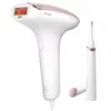 A white and rose gold IPL hair removal device and a smaller grooming attachment are displayed against a white background. Náhľad obrázku produktu