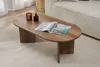 A modern living room setting with a coffee table, sofa, and rug. Produktbild-Vorschau