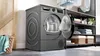 Bosch Serie 6 WQG243DR10, Wärmepumpentrockner, Grau, Seitenansicht geöffnet Produktbild-Vorschau