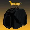 A black pet carrier bag with a paw print design on the side, set against a gradient background. Voir les images du produit