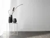 Three vases on a white side table against a white wall. Voir les images du produit