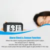 A person sleeping in bed with an alarm clock in the foreground. Anteprima dell’immagine prodotto