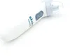 A white electric baby nasal aspirator with blue accents lies on a white surface. Anteprima dell’immagine prodotto