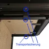 Close-up view of the underside of a fireplace, showing securing mechanisms and a heat-resistant panel. Produktbild-Vorschau