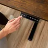 A hand is pressing buttons on a desk control panel. Náhled obrázku produktu