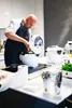 A chef is using a multi-functional cooker in a modern kitchen. Podgląd zdjęcia produktu