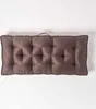 A tufted brown sofa cushion on a white background. Náhled obrázku produktu