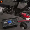 A car battery charger is connected to a car battery under the hood of a car. Náhled obrázku produktu
