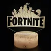 A Fortnite Battle Royale LED 3D night light with a remote control, displayed against a black background. Voir les images du produit