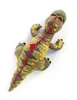 A plush toy dinosaur is shown from a top-down perspective against a white background. Produktbild-Vorschau