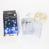 A product box and its contents, including a battery pack and LED string lights, are laid out on a white surface. Produktbild-Vorschau